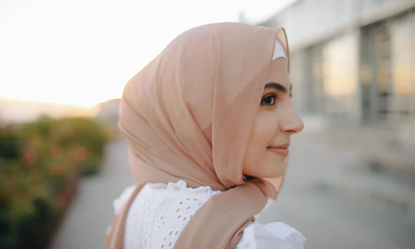 A woman wearing a chiffon scarf by Q&S Islamic Store.
