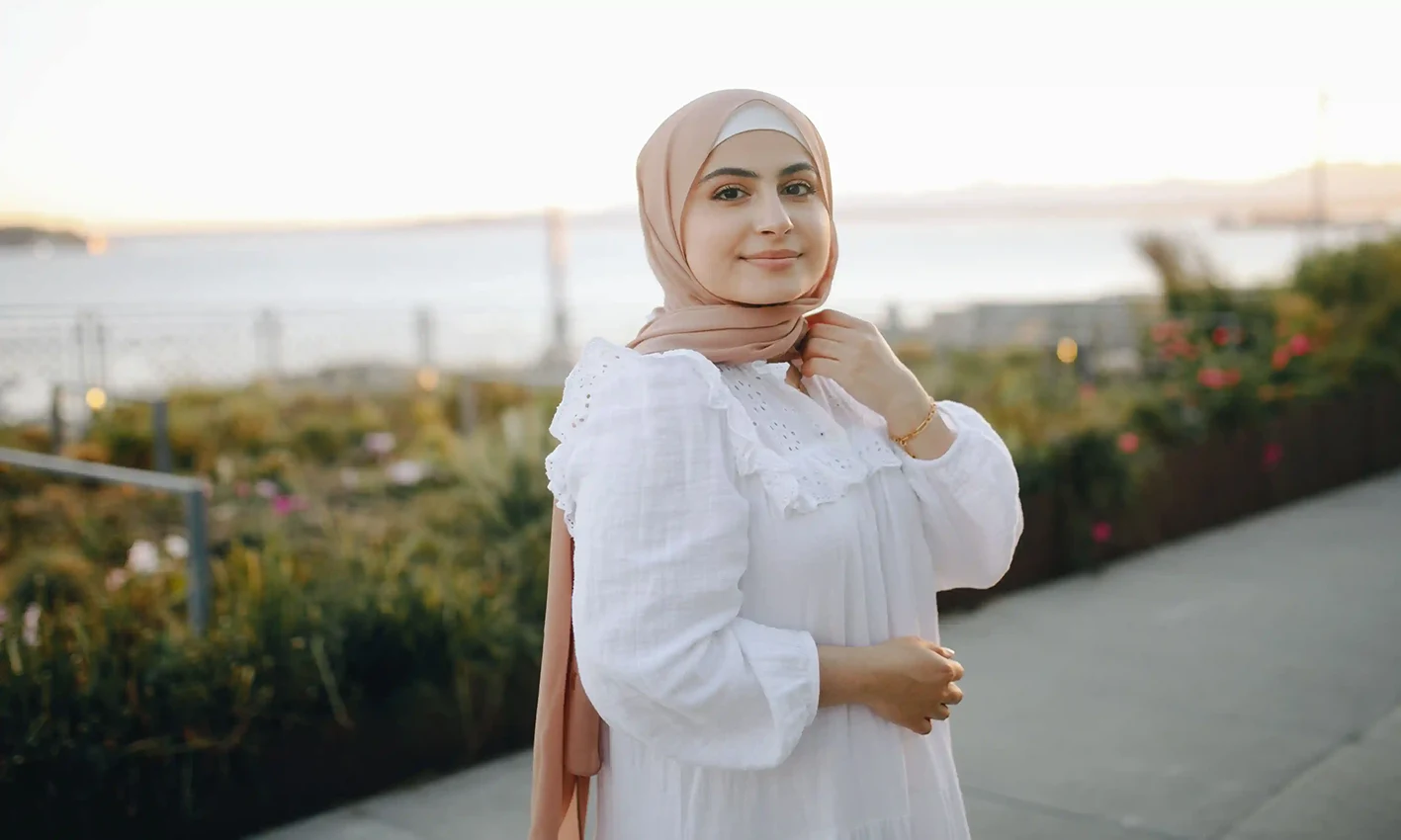 A woman wearing a chiffon scarf by Q&S Islamic Store.