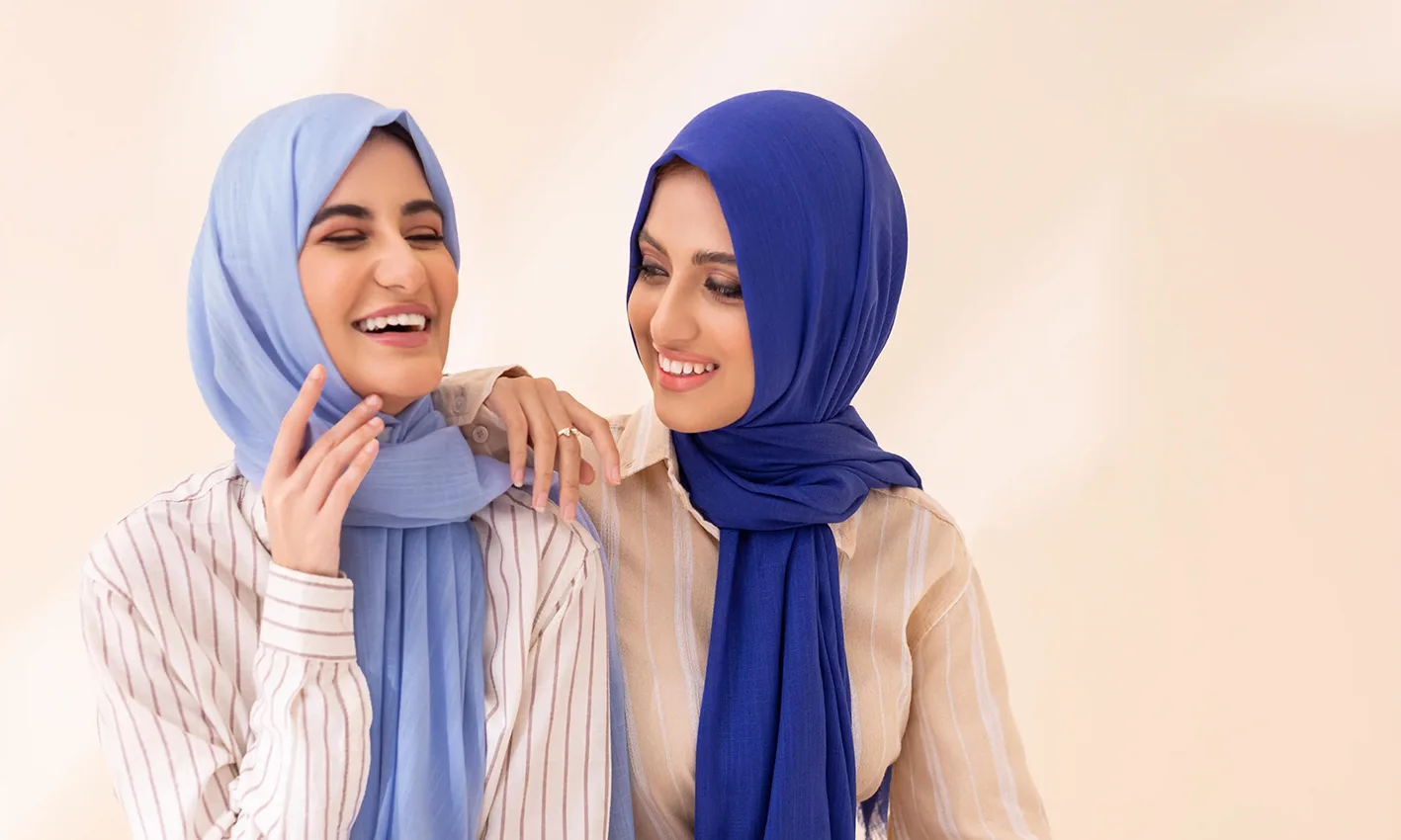 Two women wearing cotton scarves by Q&S Islamic Store.
