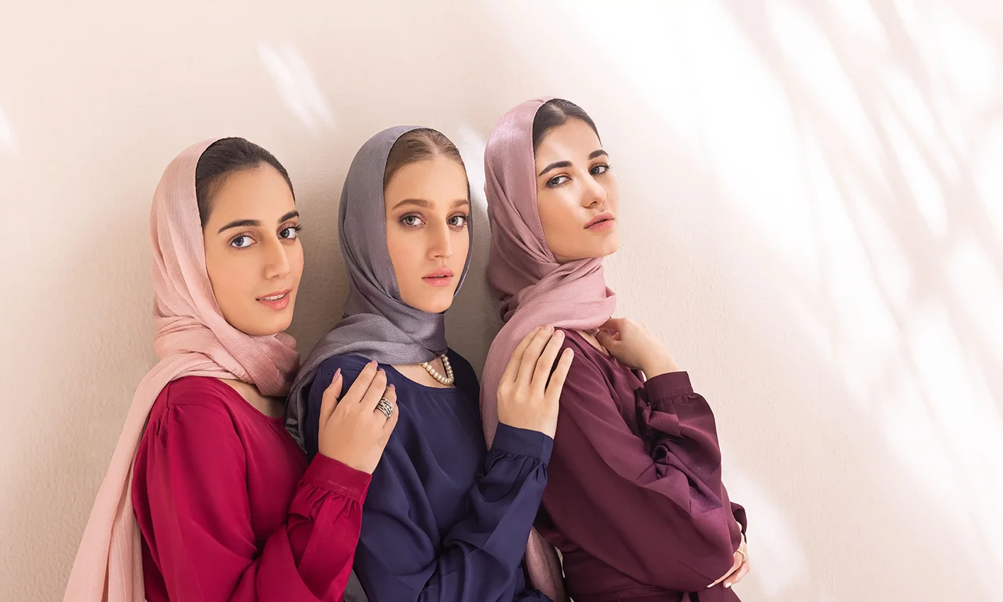 Three women wearing cotton scarves by Q&S Islamic Store.