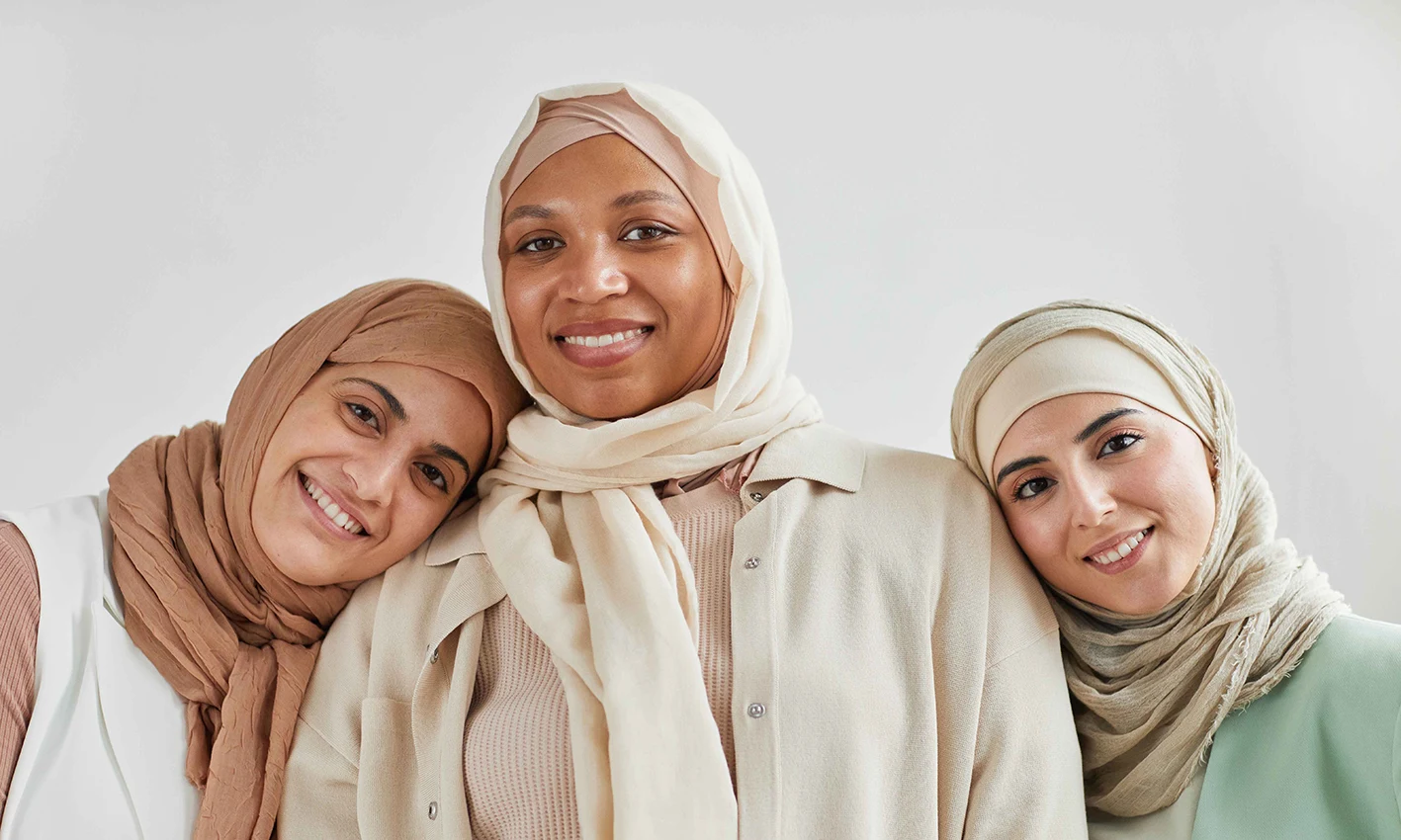 3 women wearing crinkle scarves by Q&S Islamic Store.